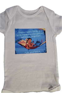 a white baby bodysuit with a quote on it