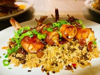 a plate with shrimp and rice on it
