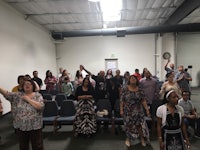 a group of people standing in a room