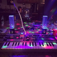 a keyboard with colorful lights on top of it
