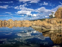 rock formations reflected in a body of water