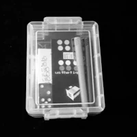 a clear plastic box with a set of dominoes in it