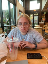 a girl sitting at a table