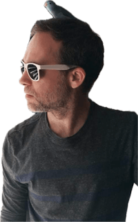 a man wearing sunglasses with a bird on his head