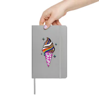 a hand holding a notebook with an ice cream cone on it