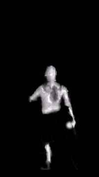 a black and white image of a man throwing a frisbee