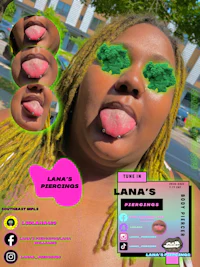 a woman with dreadlocks and a green tongue