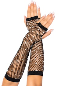 a woman's hands with fishnet gloves on them