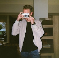 a man taking a picture of himself with a camera