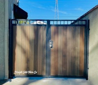 a wooden gate with a metal frame
