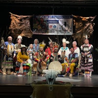 a group of people posing on a stage