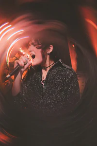 a woman singing into a microphone