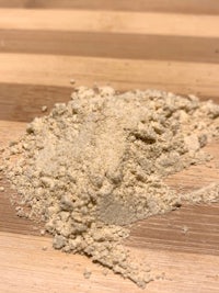 a pile of flour on a wooden table