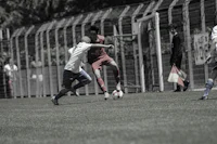 a group of people playing soccer