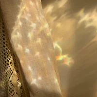 a curtain with a light shining through it
