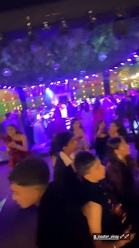 a group of people dancing at a party