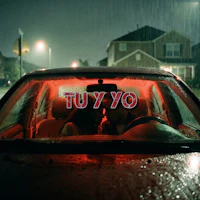 a couple sitting in a car at night with the words yo yo written on the windshield