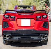 the rear end of a red sports car