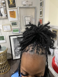 a woman with dreadlocks in her hair
