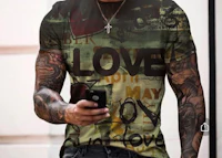 a man wearing a t - shirt with love written on it