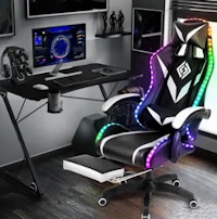 a gaming chair with lights and a monitor