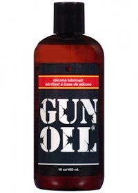 a bottle of gun oil on a white background