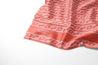 a scarf with an orange and white pattern