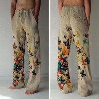 a man wearing a pair of pants with butterflies on them