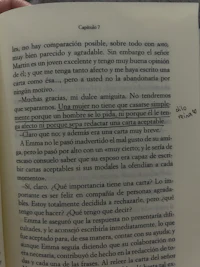 a person holding an open book with text on it