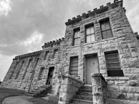 a black and white photo of a stone building