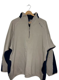 a white and blue sweatshirt hanging on a hanger