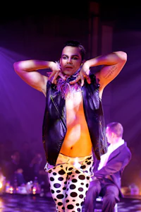 a woman in polka dot pants on a stage