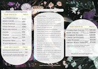 a black and white menu with flowers on it