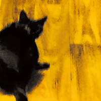 a black cat sitting on a wooden floor