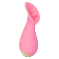 a pink vibrator with a gold ball on top
