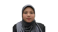 a girl in a hijab is looking at the camera