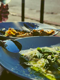 a plate of food with a glass of wine on it
