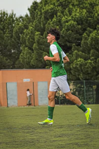 a man is running on a soccer field