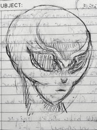 a sketch of an alien head on a piece of paper