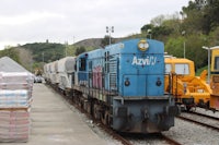 a blue train on the tracks
