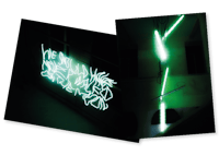 a green neon sign in a dark room