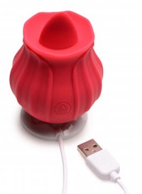 a red usb charger with a red flower on it