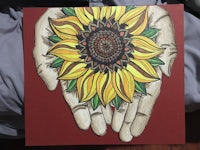 a painting of a hand holding a sunflower