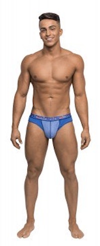 a man in blue underwear posing in front of a white background