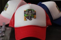 two hats with an elephant on them