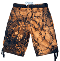 a pair of orange and black cargo shorts