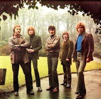 a group of men standing in a park
