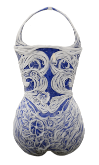 the back of a blue and white ceramic vase