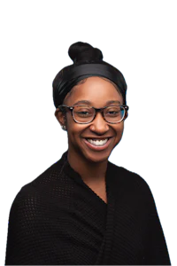 a smiling woman wearing glasses and a black scarf