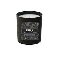 a candle with the word libra on it